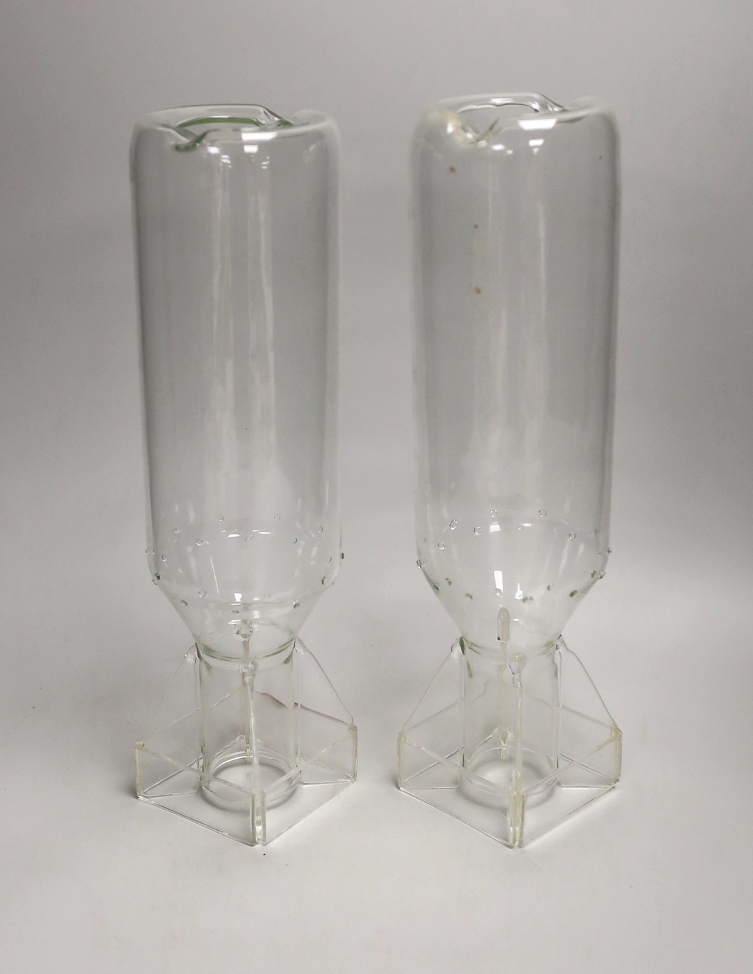 A pair of glass ‘hydrogen bomb’ shaped candleholders, 36cm tall